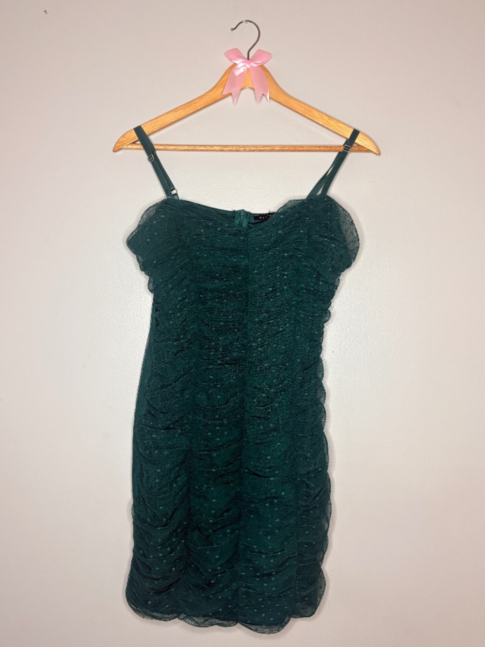 Green polka dot ruched dress very flattering, stretchy. Only worn once